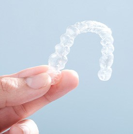 Patient holding clear aligner