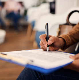 a patient reviewing a dental insurance form