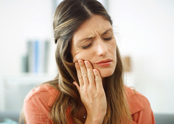 Closeup of woman experiencing toothache